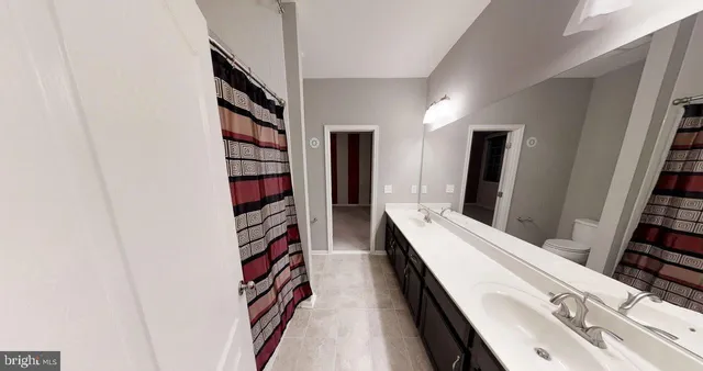 a kitchen with stainless steel appliances granite countertop a sink stove and microwave