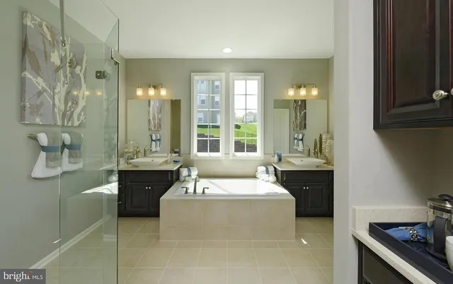 a reading room with furniture wooden floor and a chandelier