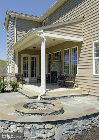 a view of wooden floor and windows in a room