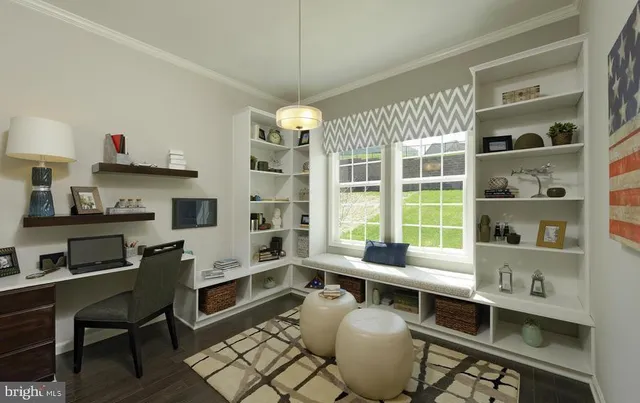 a living room with furniture and a wall clock