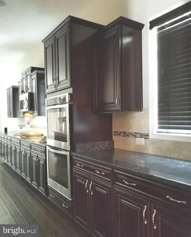 a bedroom with a large bed and a table