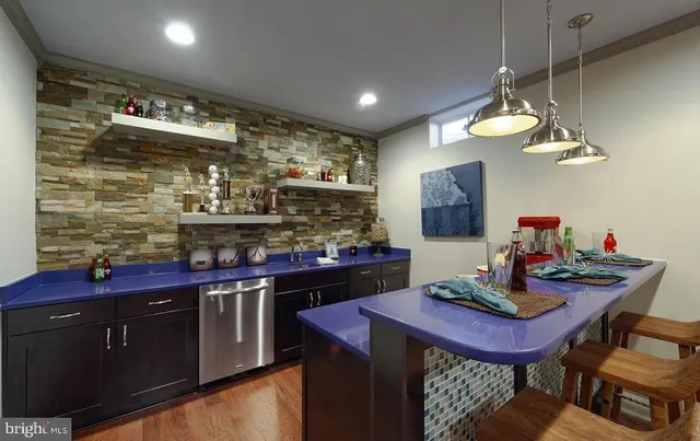 a kitchen with stainless steel appliances a refrigerator and counter