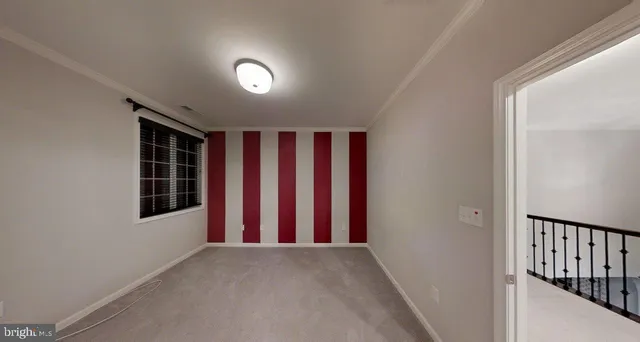 a view of wooden floor and windows in a room