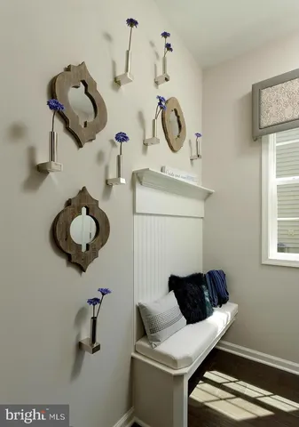 a kitchen with sink refrigerator dining table and chairs