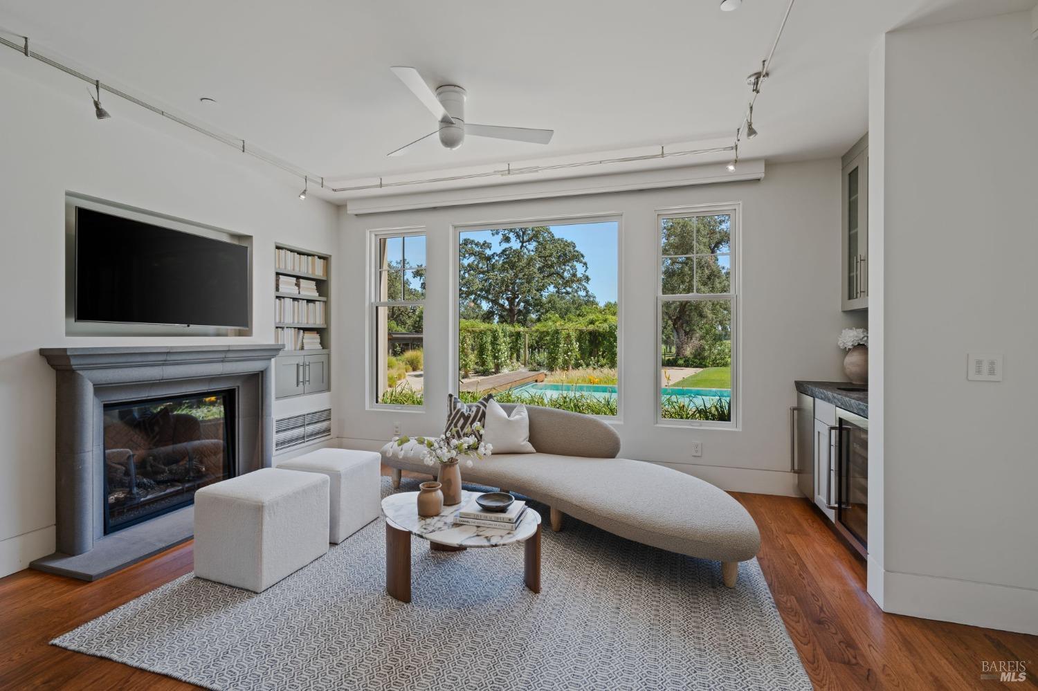 2000 Atlas Peak Road Napa, CA 94558 - Photo 11 of 80 a living room with furniture a fireplace and a flat screen tv