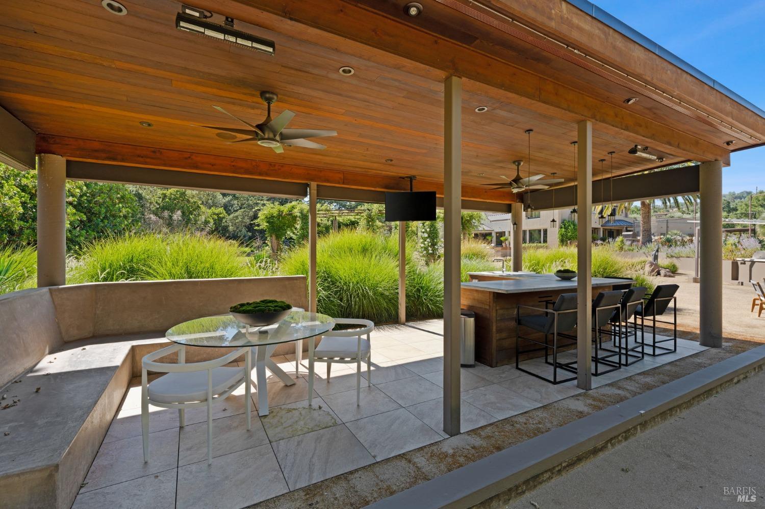 2000 Atlas Peak Road Napa, CA 94558 - Photo 18 of 80 a view of a patio with a table chairs and a small yard
