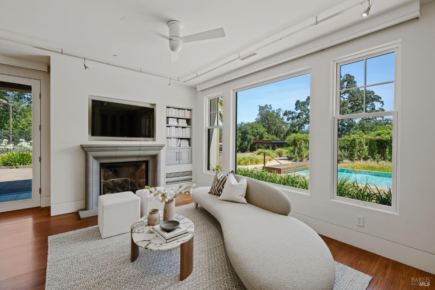 2000 Atlas Peak Road Napa, CA 94558 - Photo 20 of 80 a living room with furniture a fireplace and a large window