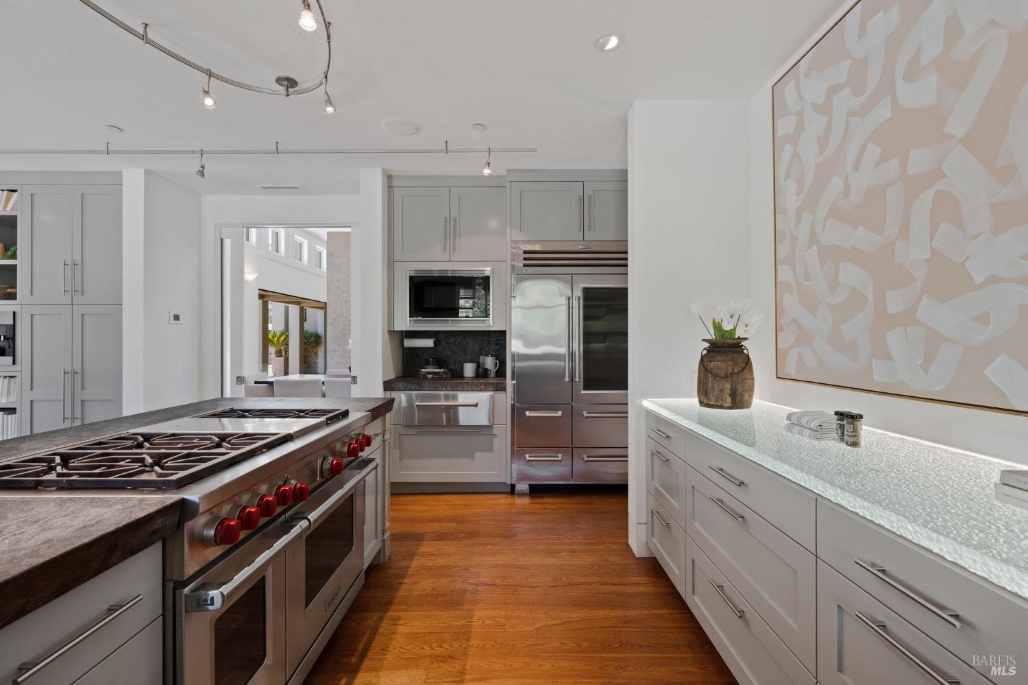 2000 Atlas Peak Road Napa, CA 94558 - Photo 25 of 80 a kitchen with stainless steel appliances a sink stove and cabinets