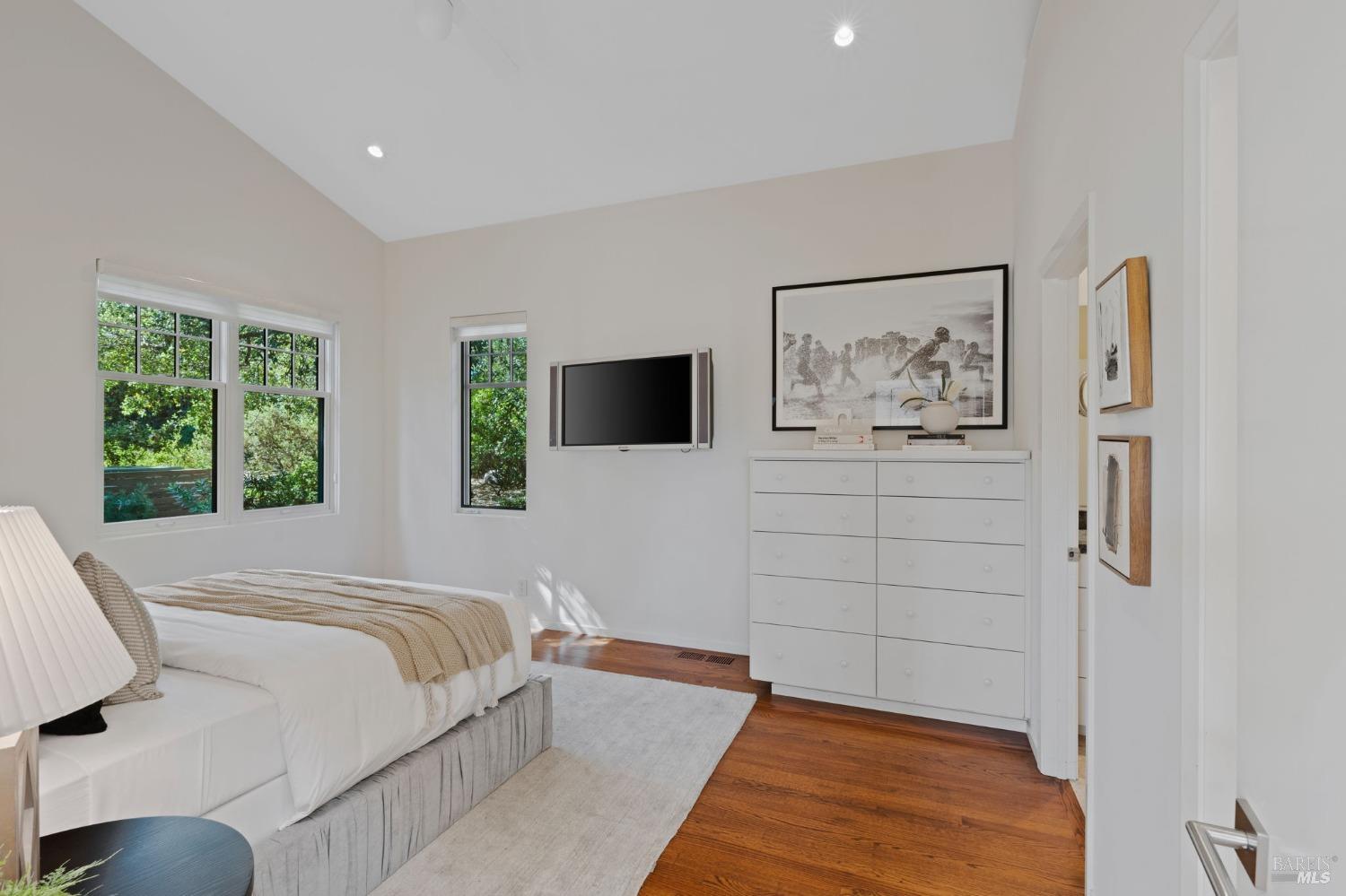 2000 Atlas Peak Road Napa, CA 94558 - Photo 62 of 80 a bedroom with a bed and a flat screen tv