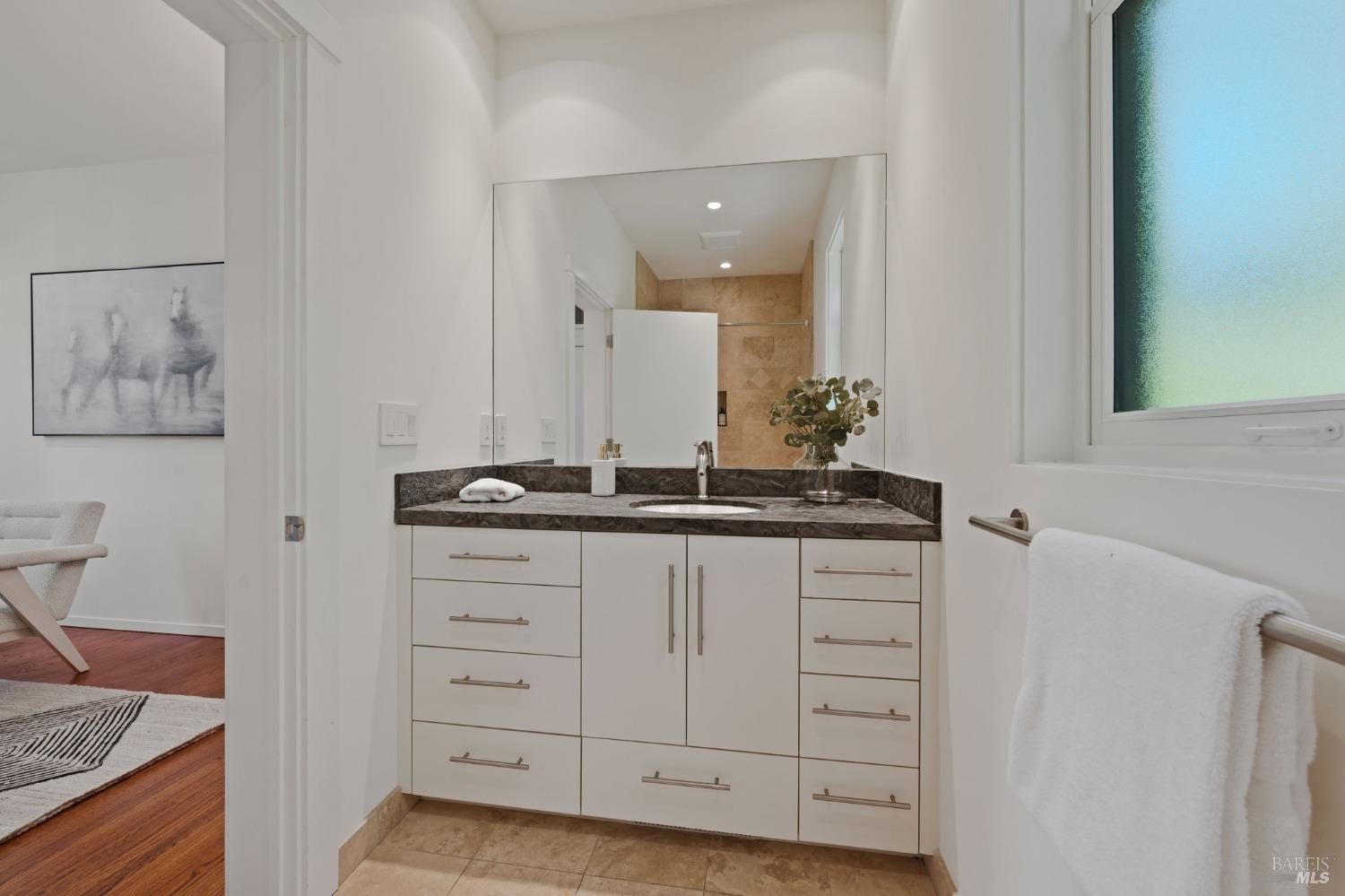 2000 Atlas Peak Road Napa, CA 94558 - Photo 65 of 80 a bathroom with a granite countertop sink and a mirror
