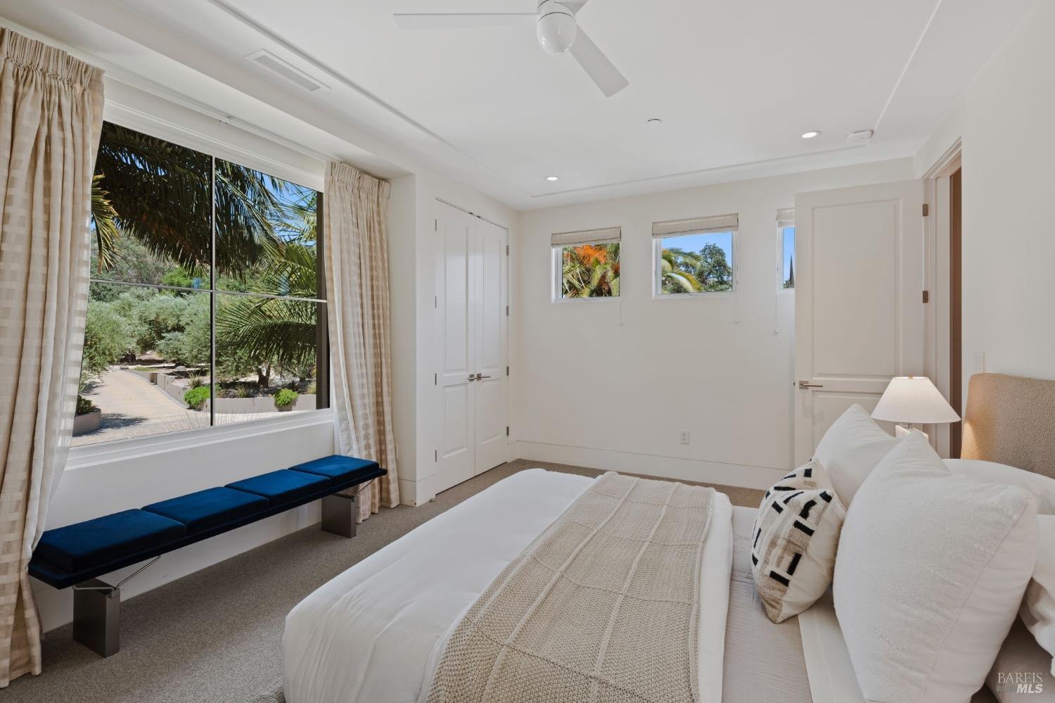 2000 Atlas Peak Road Napa, CA 94558 - Photo 68 of 80 a bedroom with a bed and a painting on the wall