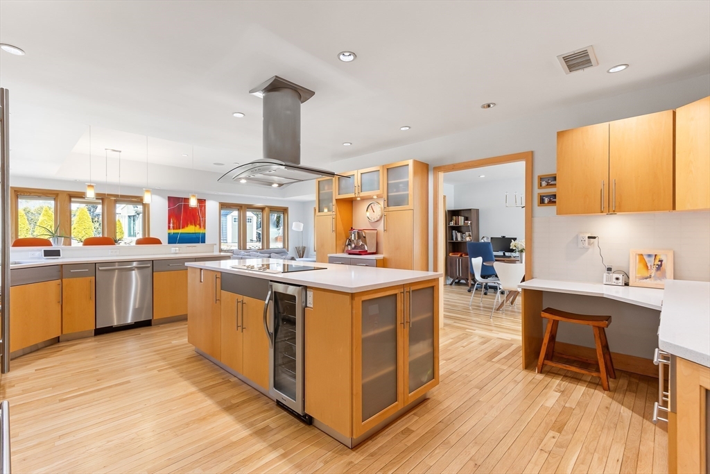 42 Fairhaven Road Newton, MA 02459 - Photo 8 of 38 a kitchen with stainless steel appliances granite countertop a stove and a wooden floors