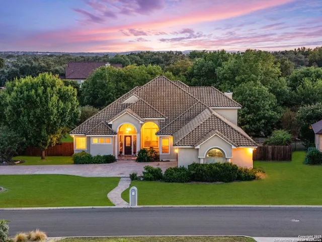an aerial view of a house with a garden