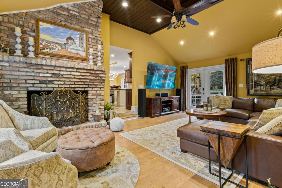 1532 Huntingdon Trail Atlanta, GA 30350 - Photo 24 of 68 a living room with fireplace furniture and a rug