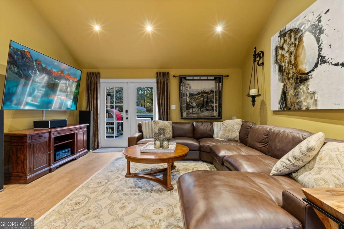 1532 Huntingdon Trail Atlanta, GA 30350 - Photo 25 of 68 a living room with furniture and a flat screen tv