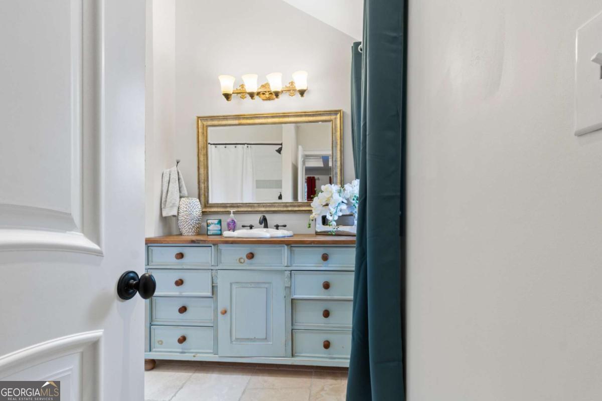 1532 Huntingdon Trail Atlanta, GA 30350 - Photo 30 of 68 a bathroom with a sink mirror and vanity