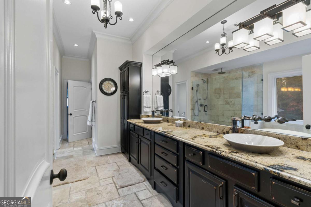 1532 Huntingdon Trail Atlanta, GA 30350 - Photo 37 of 68 a bathroom with a granite countertop sink a large mirror and a shower