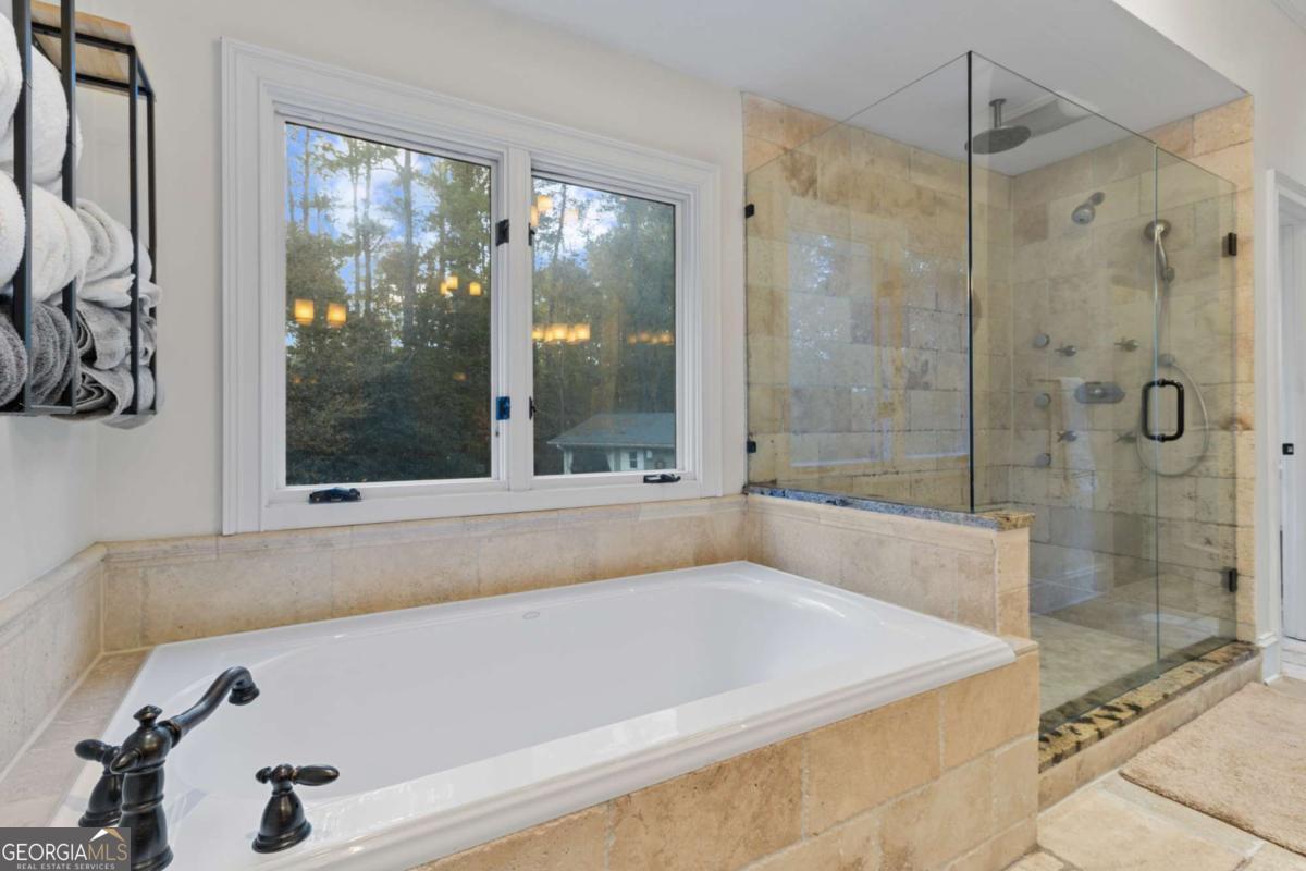 1532 Huntingdon Trail Atlanta, GA 30350 - Photo 38 of 68 a bathroom with a bath tub and shower