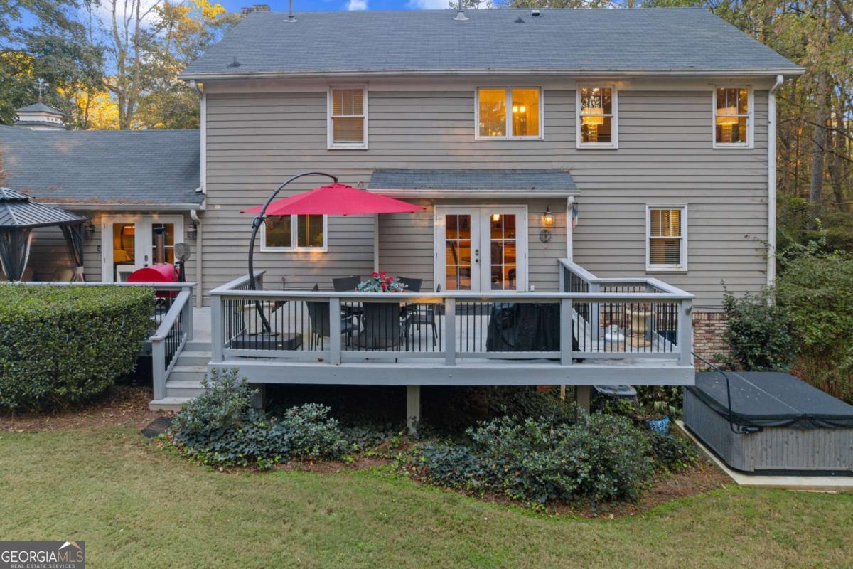 1532 Huntingdon Trail Atlanta, GA 30350 - Photo 40 of 68 a view of house with roof deck and porch