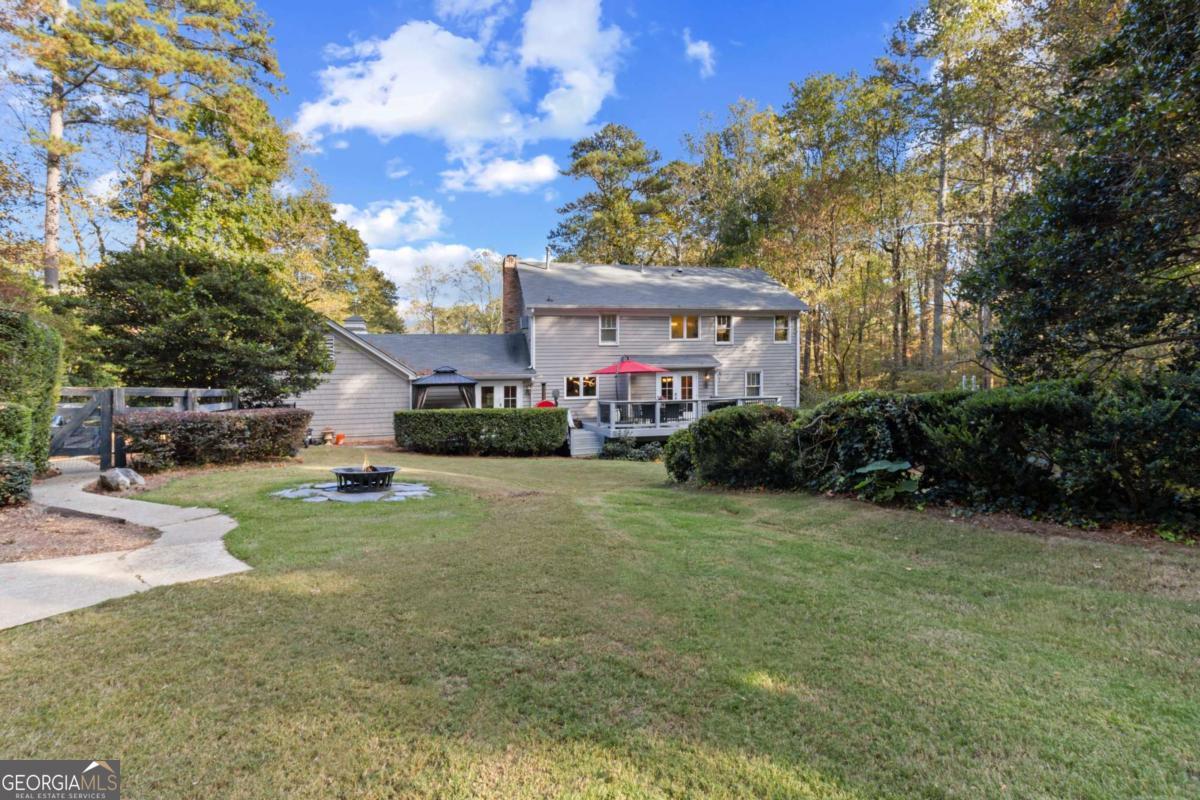 1532 Huntingdon Trail Atlanta, GA 30350 - Photo 41 of 68 a front view of a house with a yard and trees