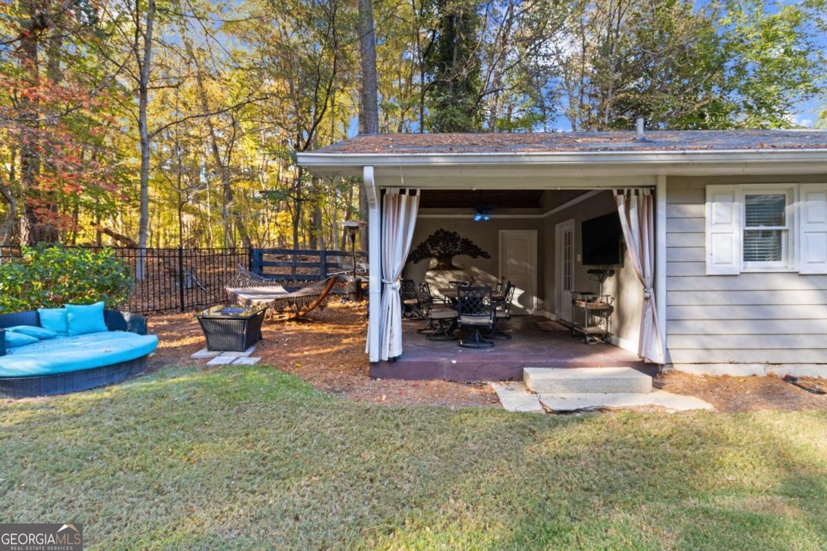 1532 Huntingdon Trail Atlanta, GA 30350 - Photo 45 of 68 a view of a house with backyard and sitting area
