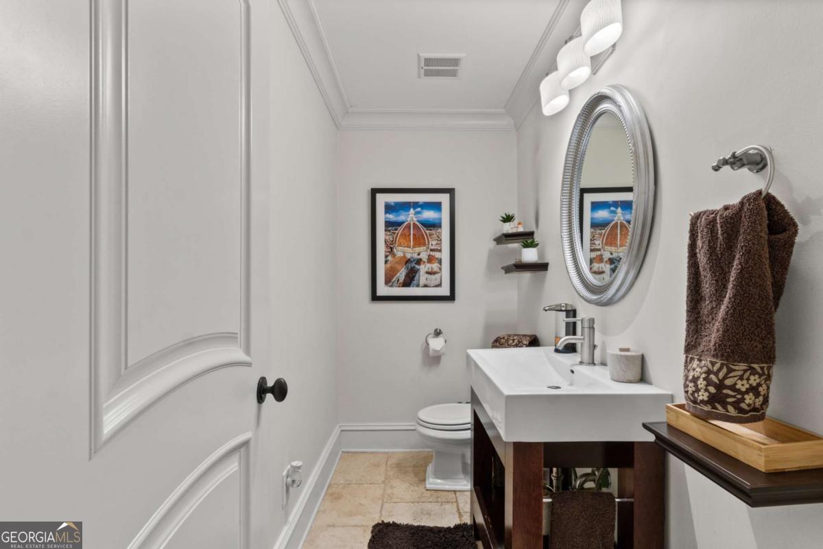 1532 Huntingdon Trail Atlanta, GA 30350 - Photo 50 of 68 a bathroom with a sink and a mirror