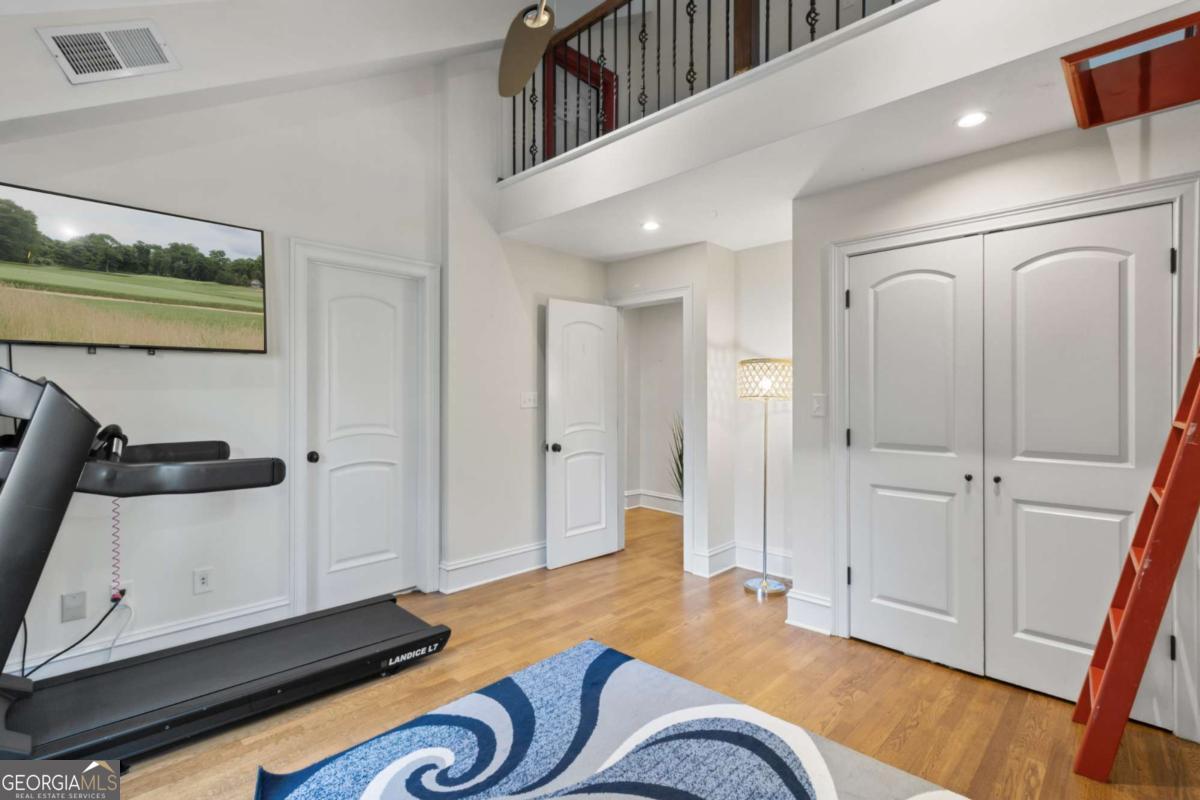 1532 Huntingdon Trail Atlanta, GA 30350 - Photo 52 of 68 a living room with furniture and a wooden floor