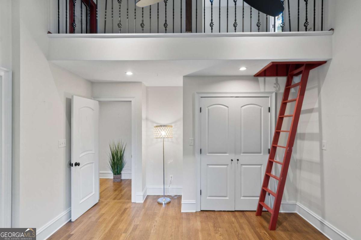 1532 Huntingdon Trail Atlanta, GA 30350 - Photo 53 of 68 a view of a hallway with wooden floor and staircase