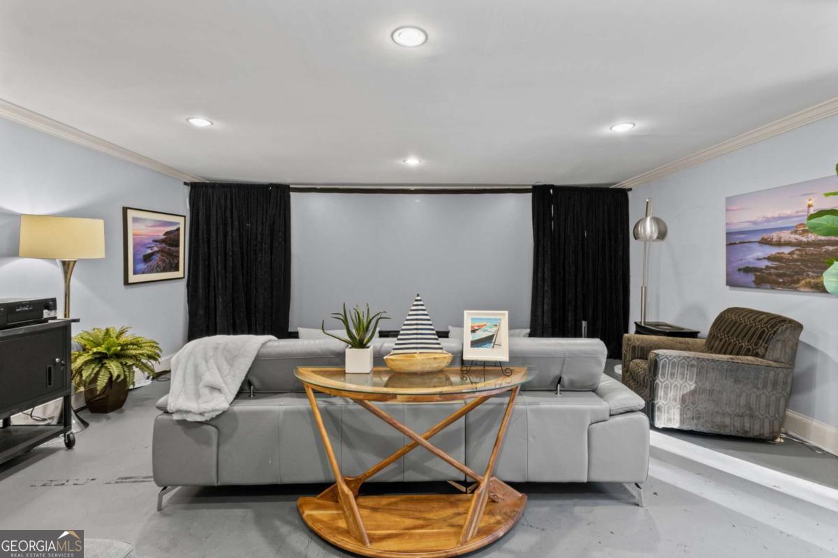 1532 Huntingdon Trail Atlanta, GA 30350 - Photo 58 of 68 a living room with furniture and a gym