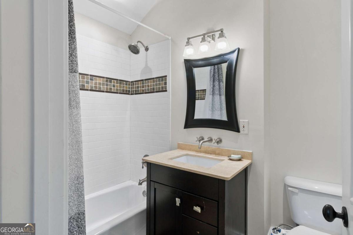 1532 Huntingdon Trail Atlanta, GA 30350 - Photo 60 of 68 a bathroom with a sink and a mirror