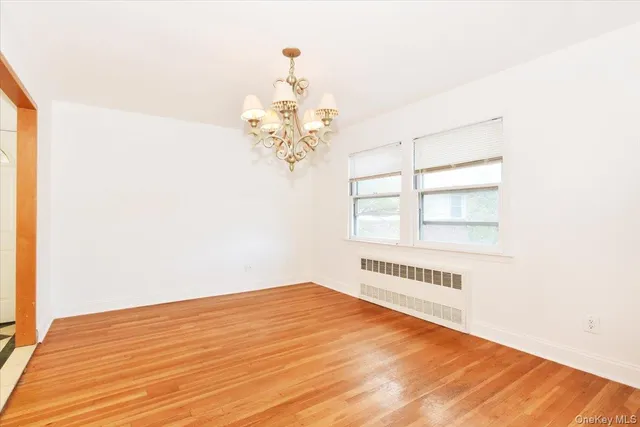 a view of a kitchen with a sink and a window
