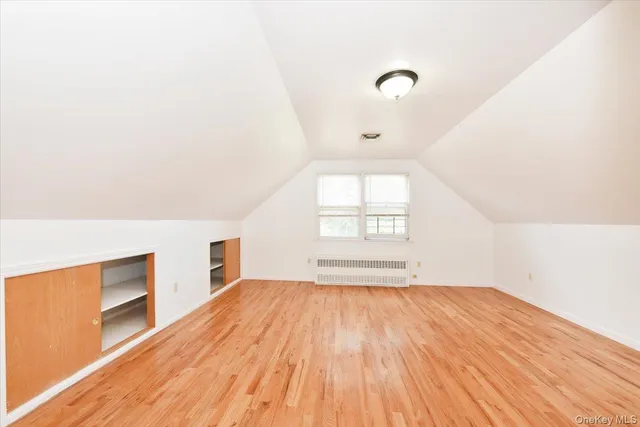 a bathroom with a granite countertop toilet and a sink