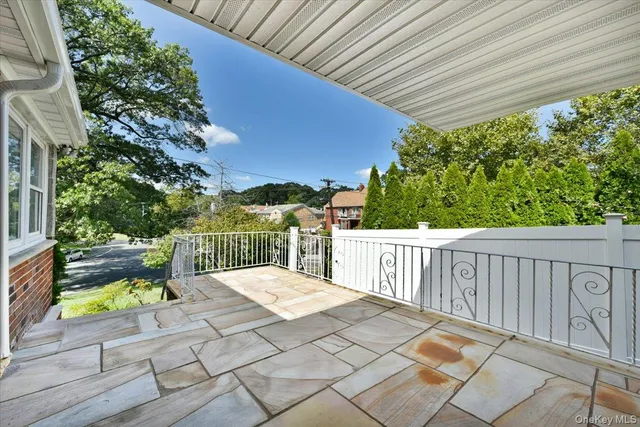 a view of a house with potted plants
