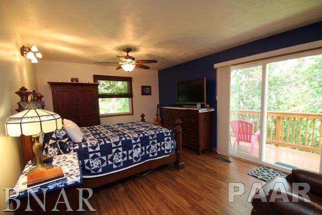 25982 Longview Road Hopedale, IL 61747 - Photo 11 of 30 a bedroom with bed and tv on dresser