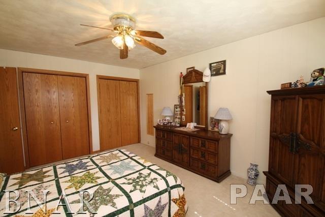 25982 Longview Road Hopedale, IL 61747 - Photo 16 of 30 a bedroom with a bed and a dresser