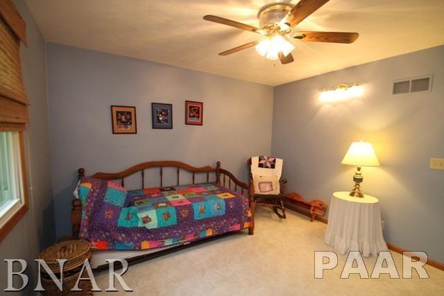 25982 Longview Road Hopedale, IL 61747 - Photo 18 of 30 a bedroom with furniture and a baby bed
