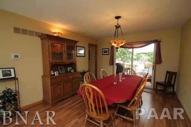 25982 Longview Road Hopedale, IL 61747 - Photo 7 of 30 a dining room with furniture a chandelier and wooden floor