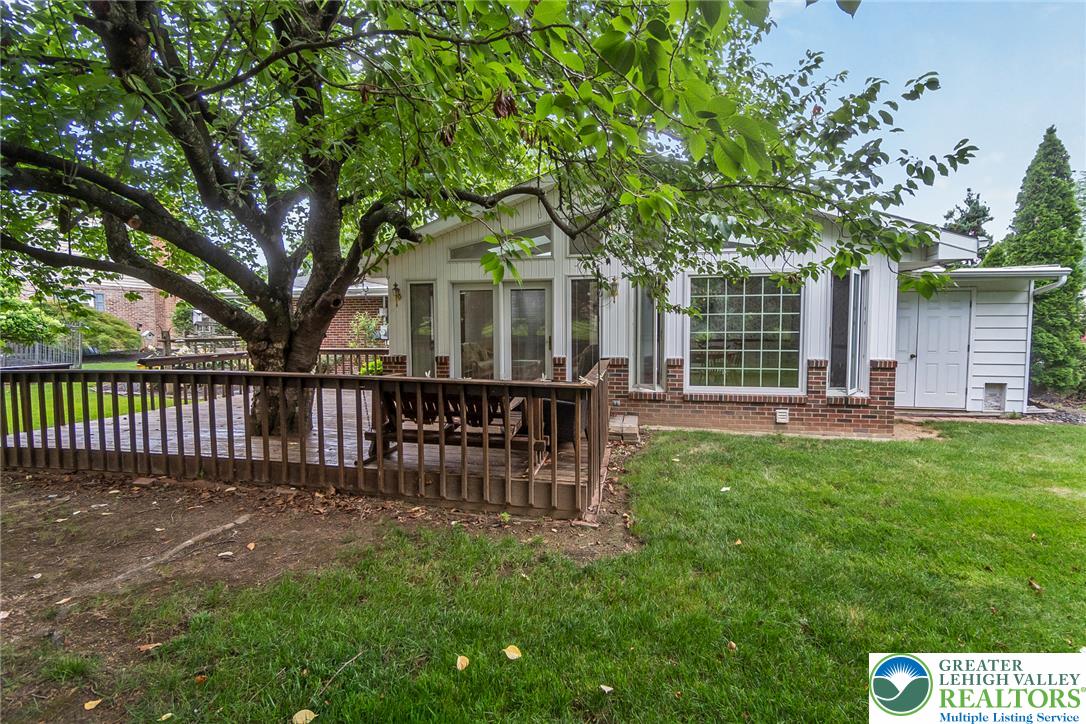 1328 Russett Road Allentown, PA 18104 - Photo 42 of 46 A spacious outdoor deck with mature trees provides an ideal setting for relaxation.