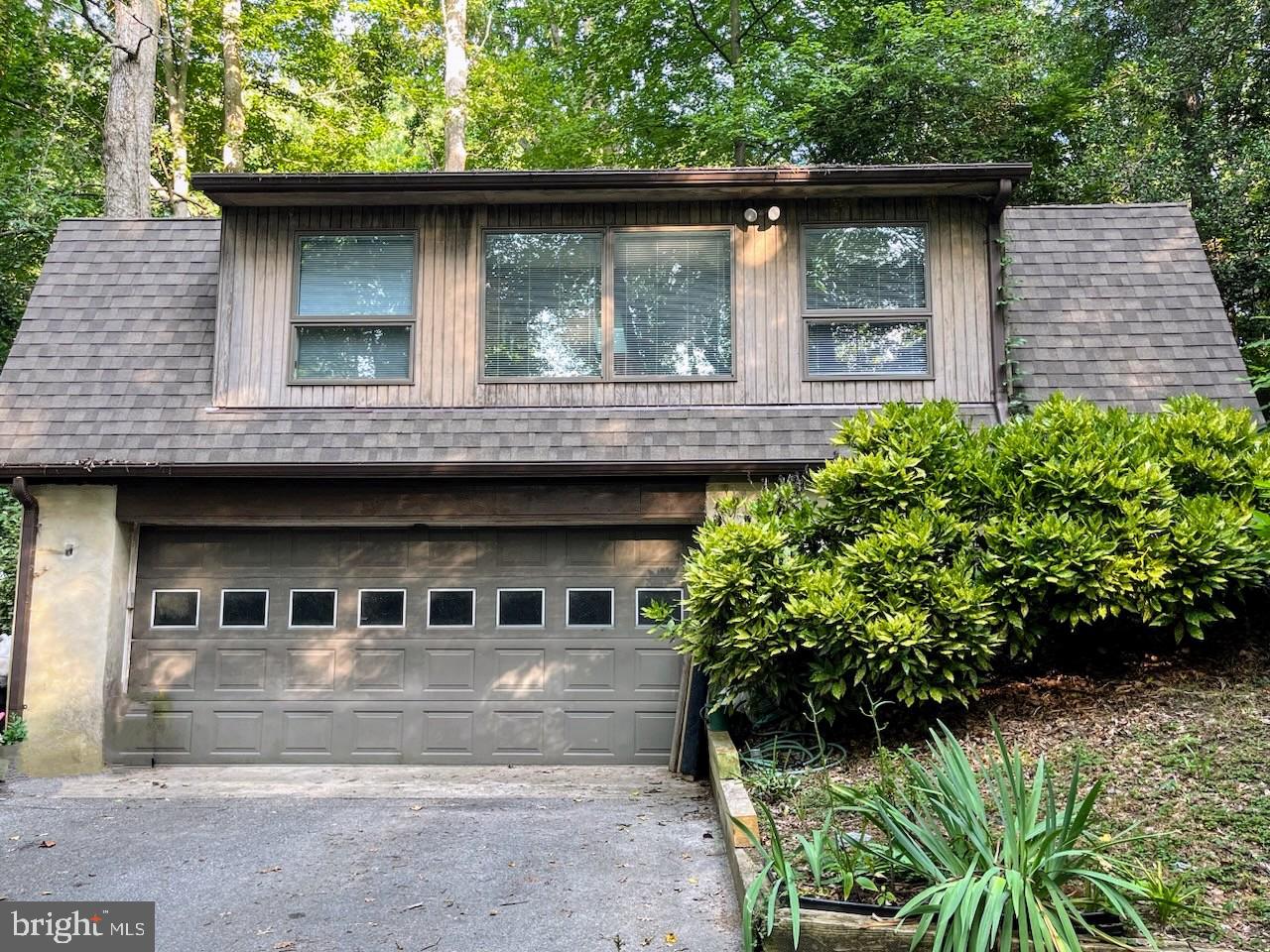 660 Willow Road, Unit A Lusby, MD 20657 - Photo 1 of 8 a front view of a house with a garden
