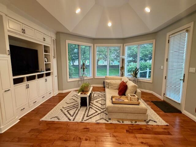 9261 Ruth Court St. John, IN 46373 - Photo 15 of 48 a living room with furniture wooden floor and a flat screen tv