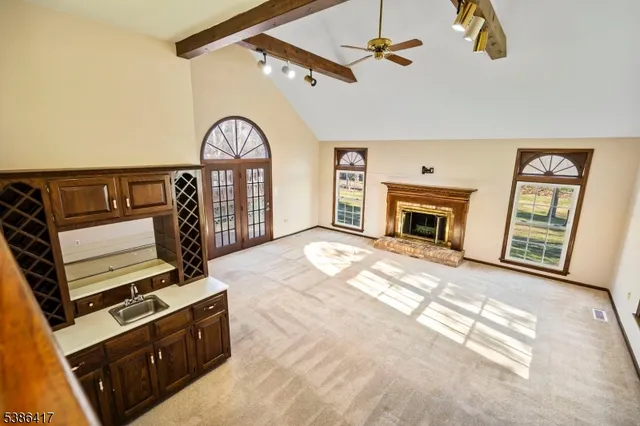 a view of a livingroom with furniture and a fireplace