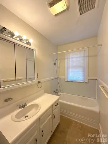 a bathroom with a sink and a bathtub