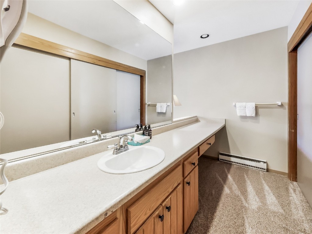 22280 Highway 6, Unit 1717 Keystone, CO 80435 - Photo 12 of 21 a bathroom with a sink double vanity and a mirror