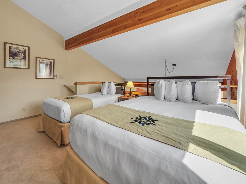 22280 Highway 6, Unit 1717 Keystone, CO 80435 - Photo 14 of 21 a spacious bedroom with two beds and painting on the wall