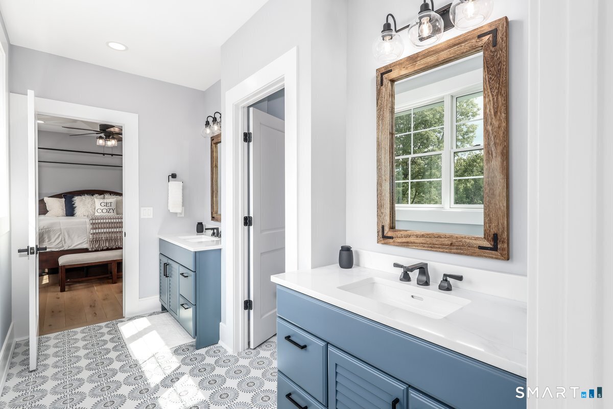 2 Pond View Lane Sherman, CT 06784 - Photo 26 of 40 a en suite bathroom with a sink and a mirror
