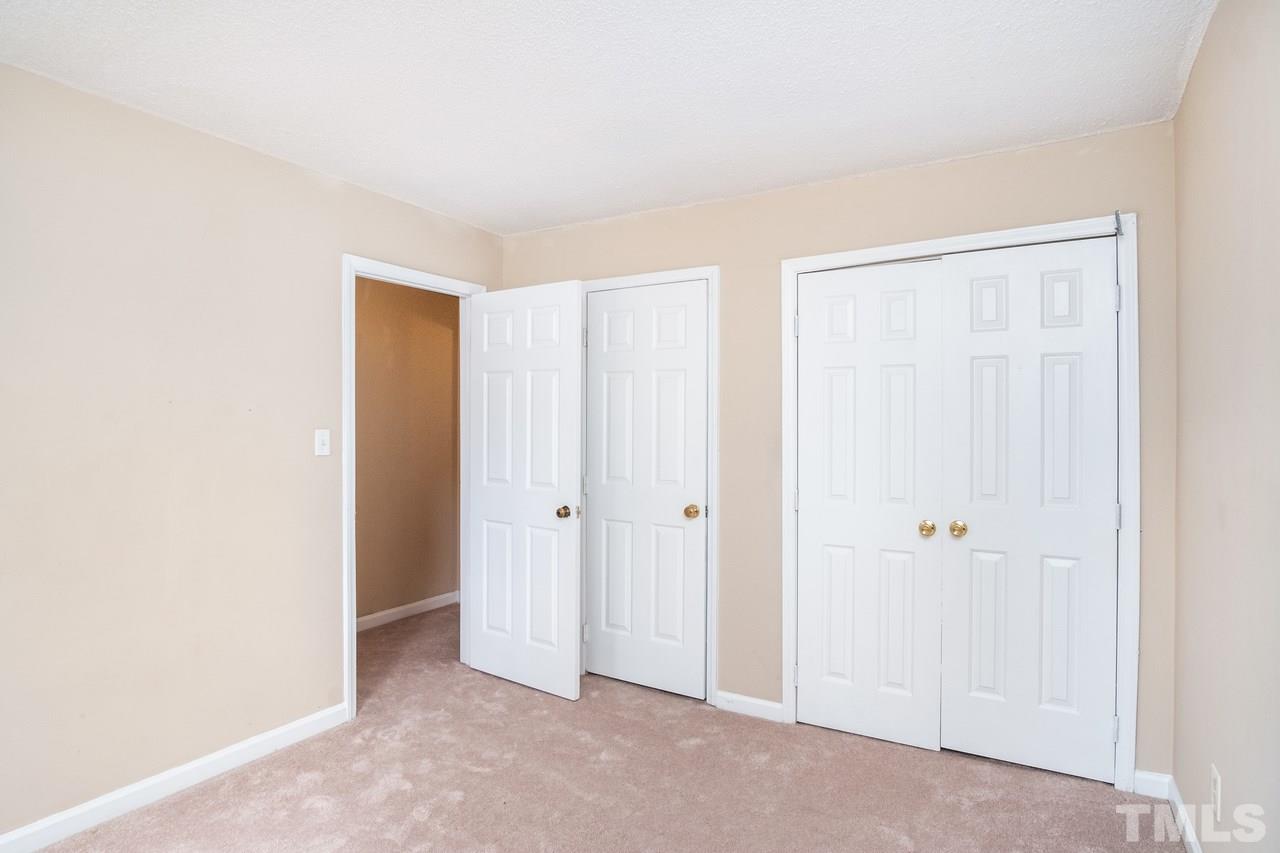 4224 Labrador Drive Raleigh, NC 27616 - Photo 14 of 22 Both 2nd floor guest bedrooms have walk-in storage area access