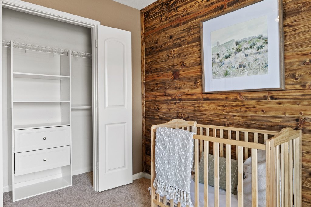 217 Farmer Lane Jarrell, TX 76537 - Photo 20 of 29 A comforting nursery with a striking wood plank accent wall, closet built-ins and abundant natural light.