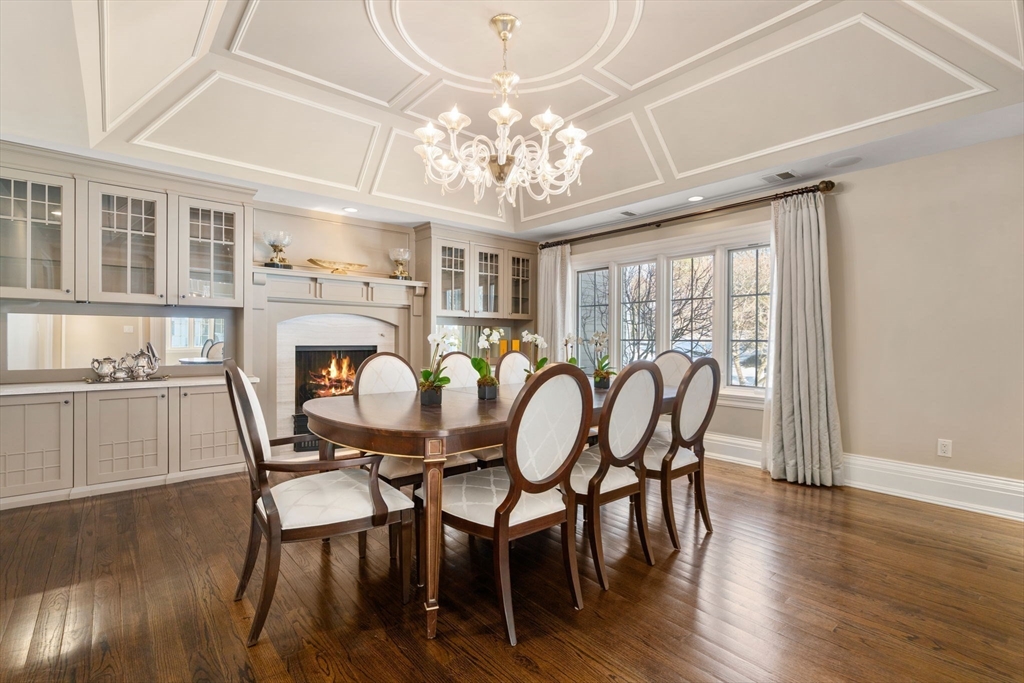 11 Hillcrest Road Weston, MA 02493 - Photo 13 of 42 a view of a dining room with furniture a chandelier and wooden floor