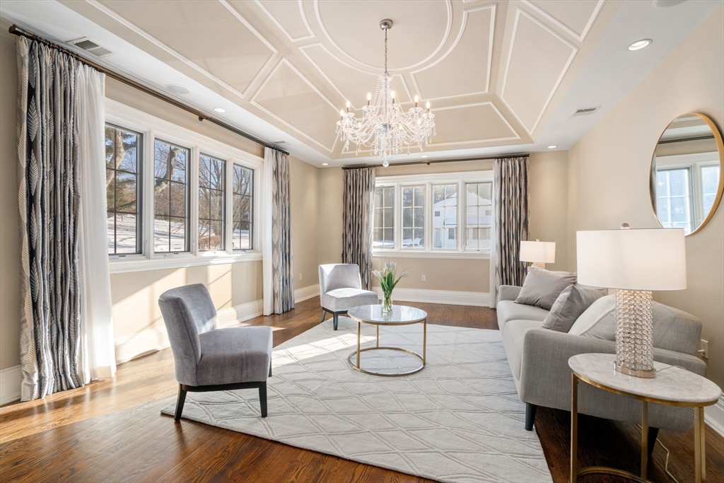 11 Hillcrest Road Weston, MA 02493 - Photo 15 of 42 a living room with furniture and a chandelier