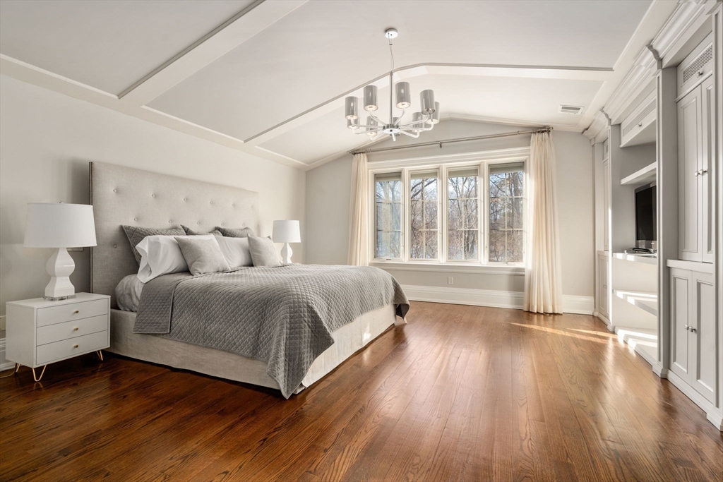 11 Hillcrest Road Weston, MA 02493 - Photo 17 of 42 a spacious bedroom with a bed and wooden floor